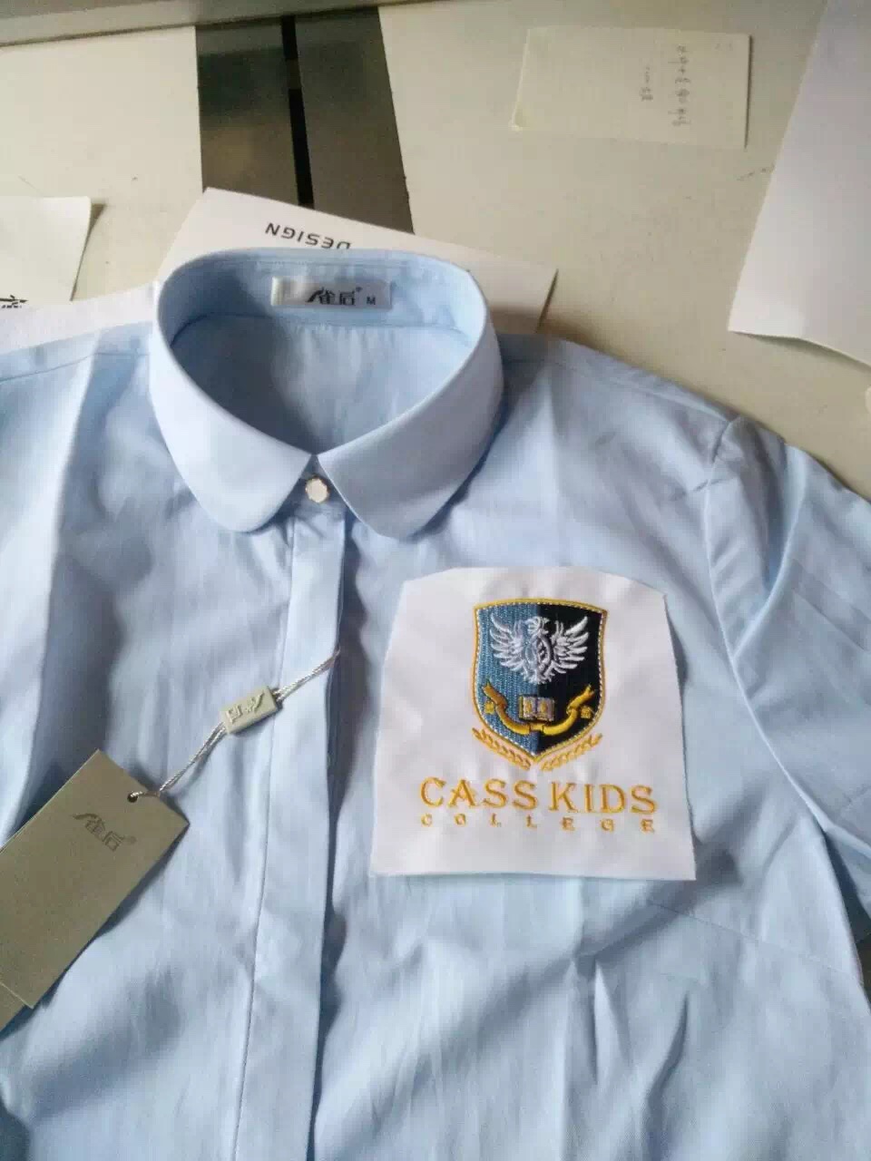 Fabbrika professjonali tad-disinn tad-disinn tad-dwana tal-logo rakkmu